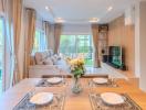 Elegant dining area with modern lighting and a view of the garden