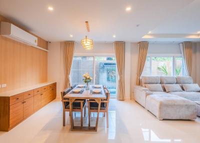 Bright and modern living room with dining area and comfortable seating