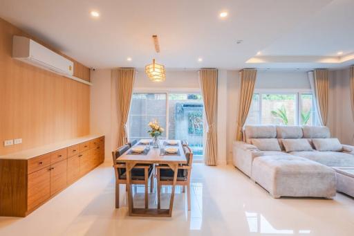 Bright and modern living room with dining area and comfortable seating