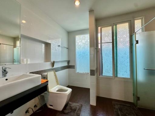 Modern bathroom with shower and frosted glass windows