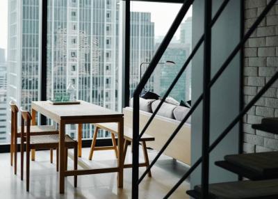 Modern living room with large windows and city view