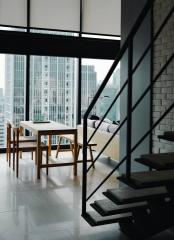 Modern living room with large windows and city view