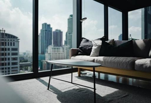 Modern living room with large windows and city view