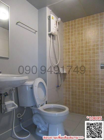 Compact bathroom with wall-mounted water heater and beige tiles