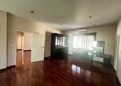 Spacious living room with natural light and hardwood floors