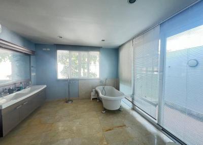 Spacious bathroom with large windows and modern fixtures