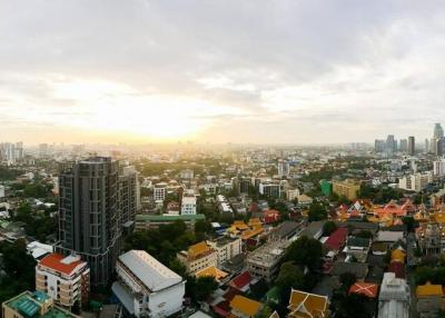 Panoramic view of a city skyline at sunset