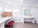 Spacious modern bathroom with clean white interiors and a touch of elegant terracotta tiles