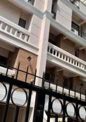 Exterior view of a multi-story apartment building with balconies