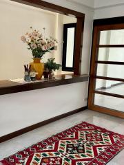 Cozy corner of a living space with decorative elements and rug