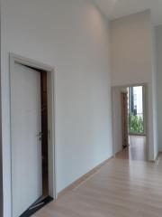 Bright and airy hallway with wooden flooring