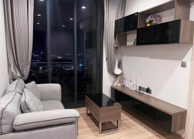 Modern living room with city view at night