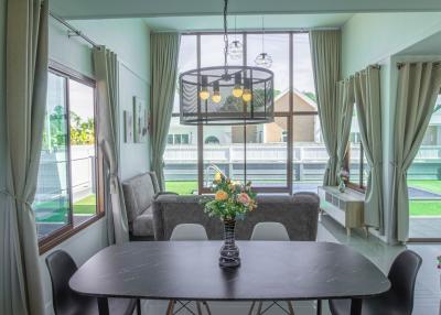 Spacious modern living room with abundant natural light and elegant furniture