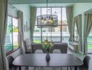Spacious modern living room with abundant natural light and elegant furniture