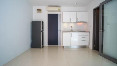 Modern kitchen with appliances and tiled flooring