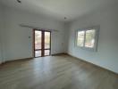 Spacious empty bedroom with ample natural light