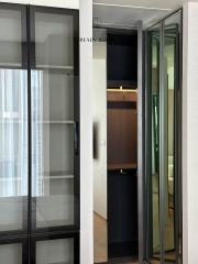 Modern interior design with sliding doors and a glimpse into a wardrobe area