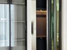 Modern interior design with sliding doors and a glimpse into a wardrobe area