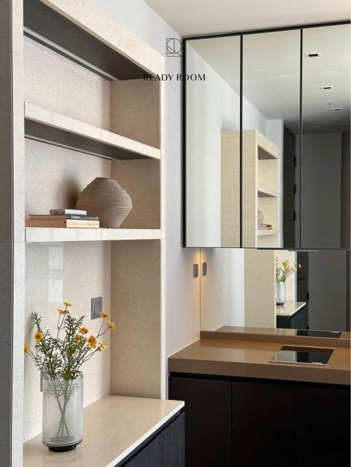 Modern interior design with elegant shelving, decorative vase, and pristine finish
