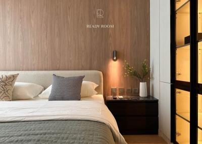 Modern bedroom with wood accent wall and elegant decor