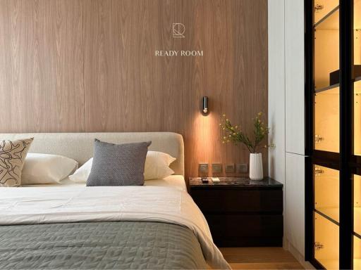 Modern bedroom with wood accent wall and elegant decor
