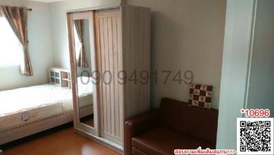 Compact bedroom with built-in wardrobe and large window