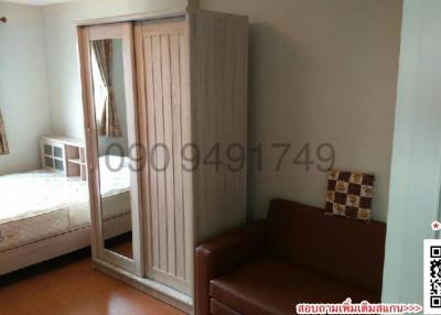 Compact bedroom with built-in wardrobe and large window