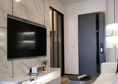 Modern bedroom with marble wall and mounted television