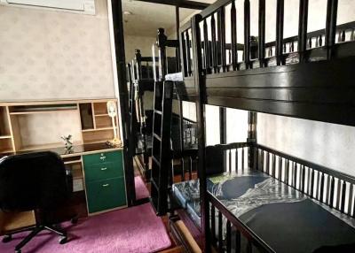 Cozy bedroom with bunk beds and a work area