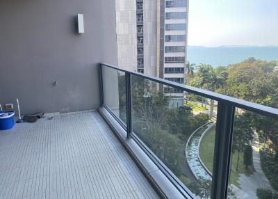 Spacious balcony with ocean view and high-rise neighboring buildings
