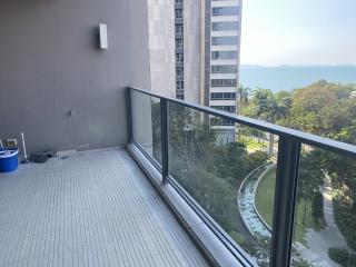 Spacious balcony with ocean view and high-rise neighboring buildings