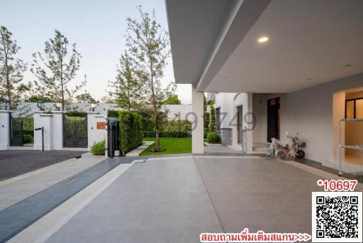 Modern home exterior with driveway and landscaped garden