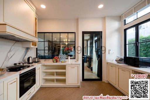 Modern kitchen with stainless steel appliances and white cabinetry