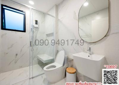 Modern Bathroom with White Marble Tiles and Glass Shower Enclosure