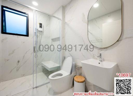 Modern Bathroom with White Marble Tiles and Glass Shower Enclosure