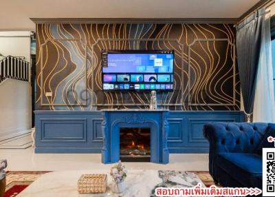 Luxurious living room with blue fireplace and unique wall design