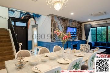 Elegant dining room with modern decor and chandelier