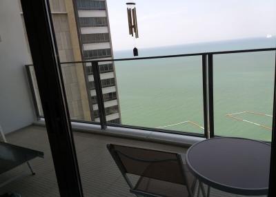 Ocean view balcony with seating arrangement