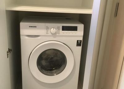 Compact laundry space with a Samsung washing machine
