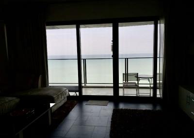 living room with large window overlooking the sea