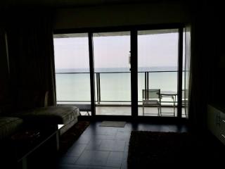 living room with large window overlooking the sea