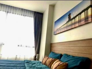 Cozy bedroom with large bed and decorative wall art