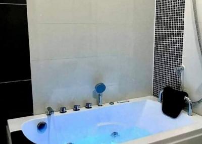 Modern bathroom with a jacuzzi tub and ambient lighting