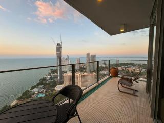 Spacious balcony with a panoramic sea view at sunset