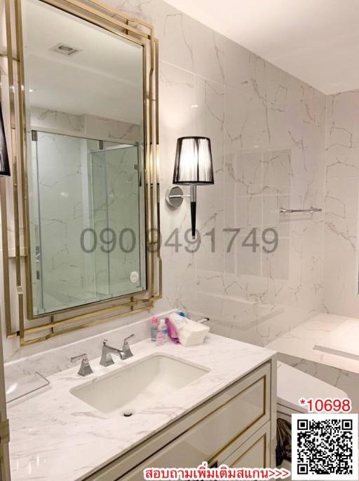 Elegant bathroom interior with marble finishes and modern lighting