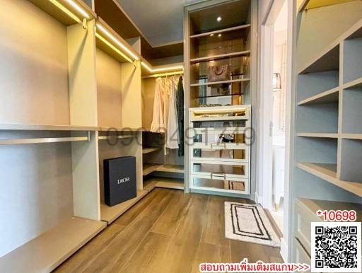 Spacious bedroom with built-in wardrobe and elegant wooden flooring