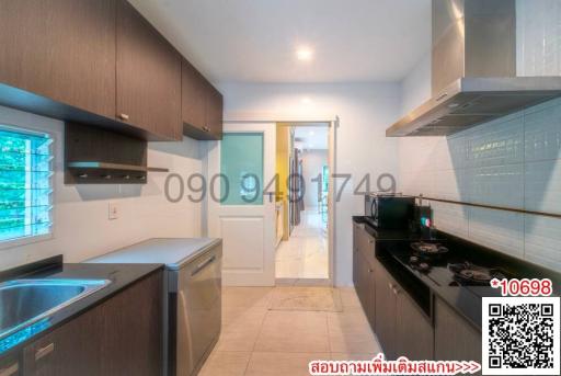 Modern kitchen with stainless steel appliances and wooden cabinets