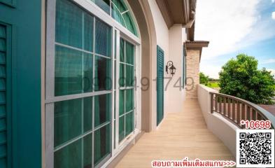 Spacious balcony with large windows and a scenic view