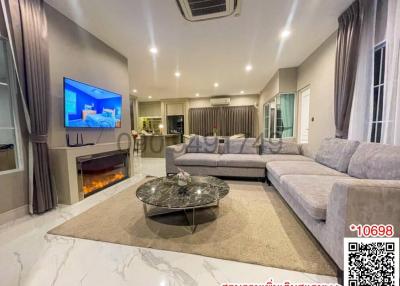 Spacious modern living room with comfortable seating and contemporary design