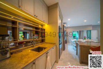 Modern kitchen with bar counter and open plan layout